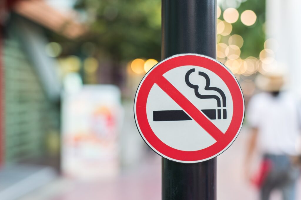No smoking sign in the public garden on blur background